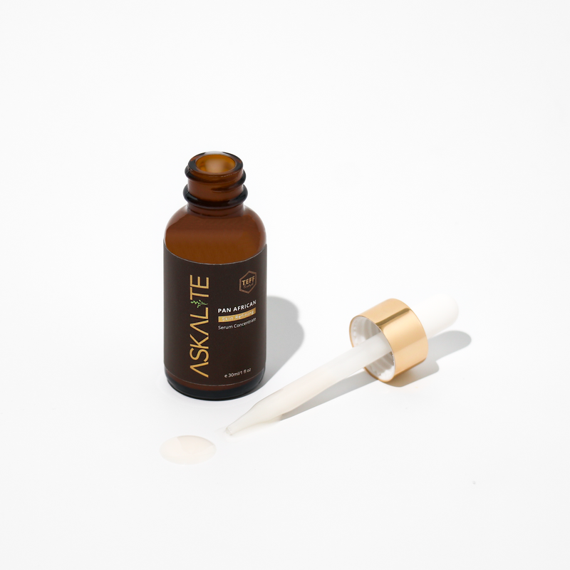 Askalite Formula Pan African Serum made with ceramides, hyaluronic acid and eragrostis teff to fight hyperpigmentation, soften and minimize the look of pores for a luminous skin